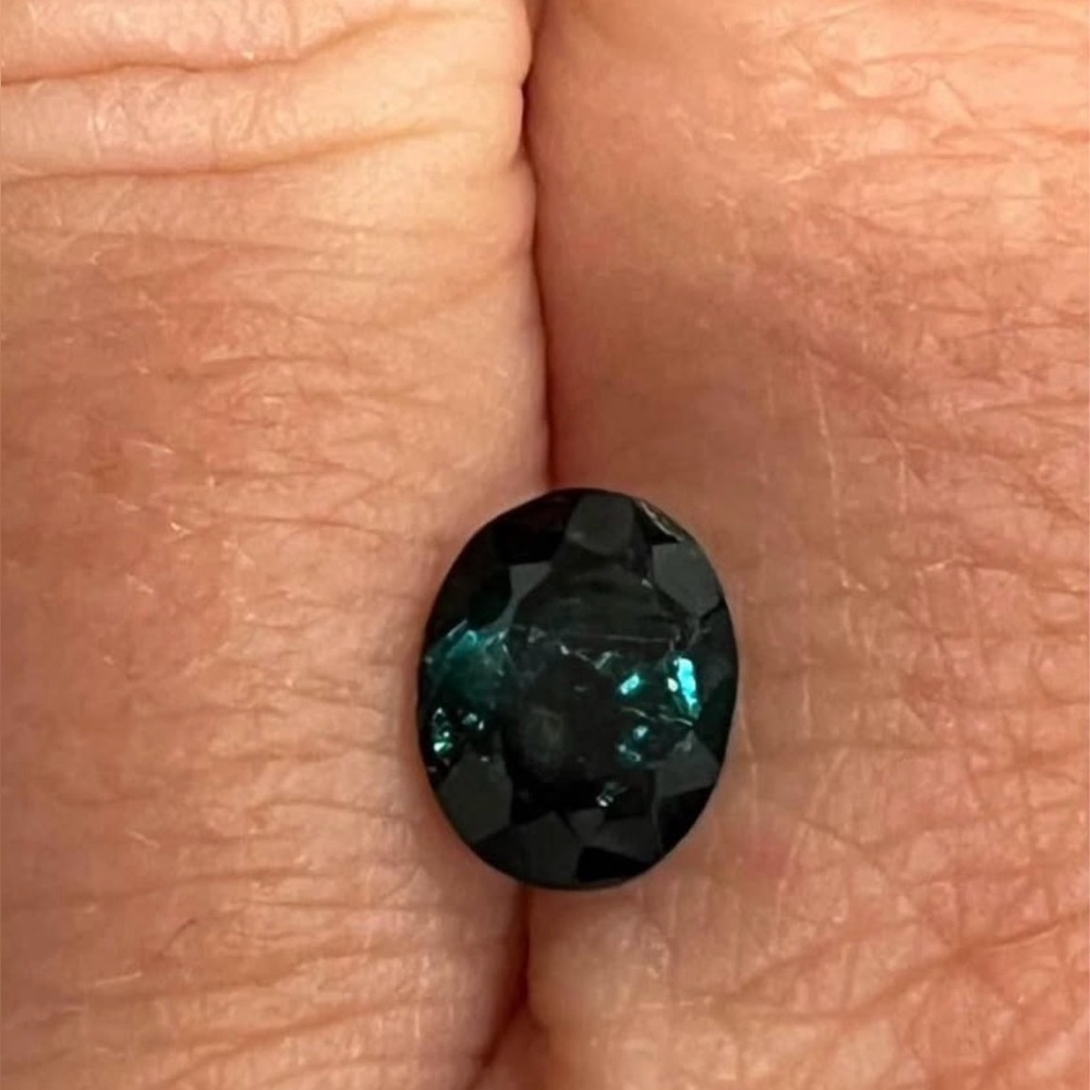 1.47 carat oval shaped green tourmaline (October birthstone)